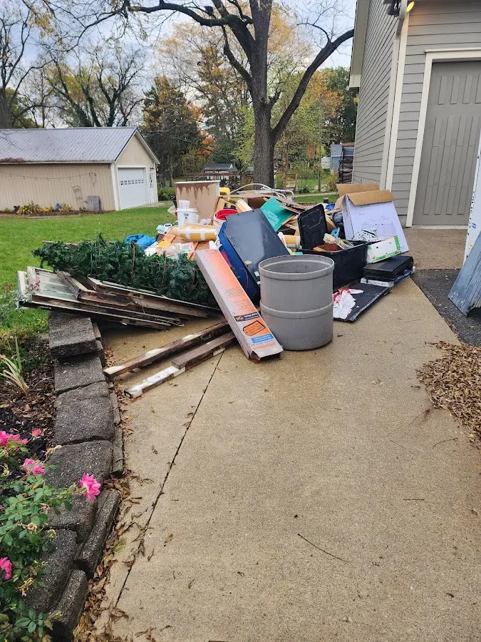 Dumpster being loaded with debris for Estate Cleanout Dumpster Rental in Homestead Meadows North